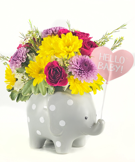 Elephant keepsake with hot pink roses, green hydrangea, and white daisies